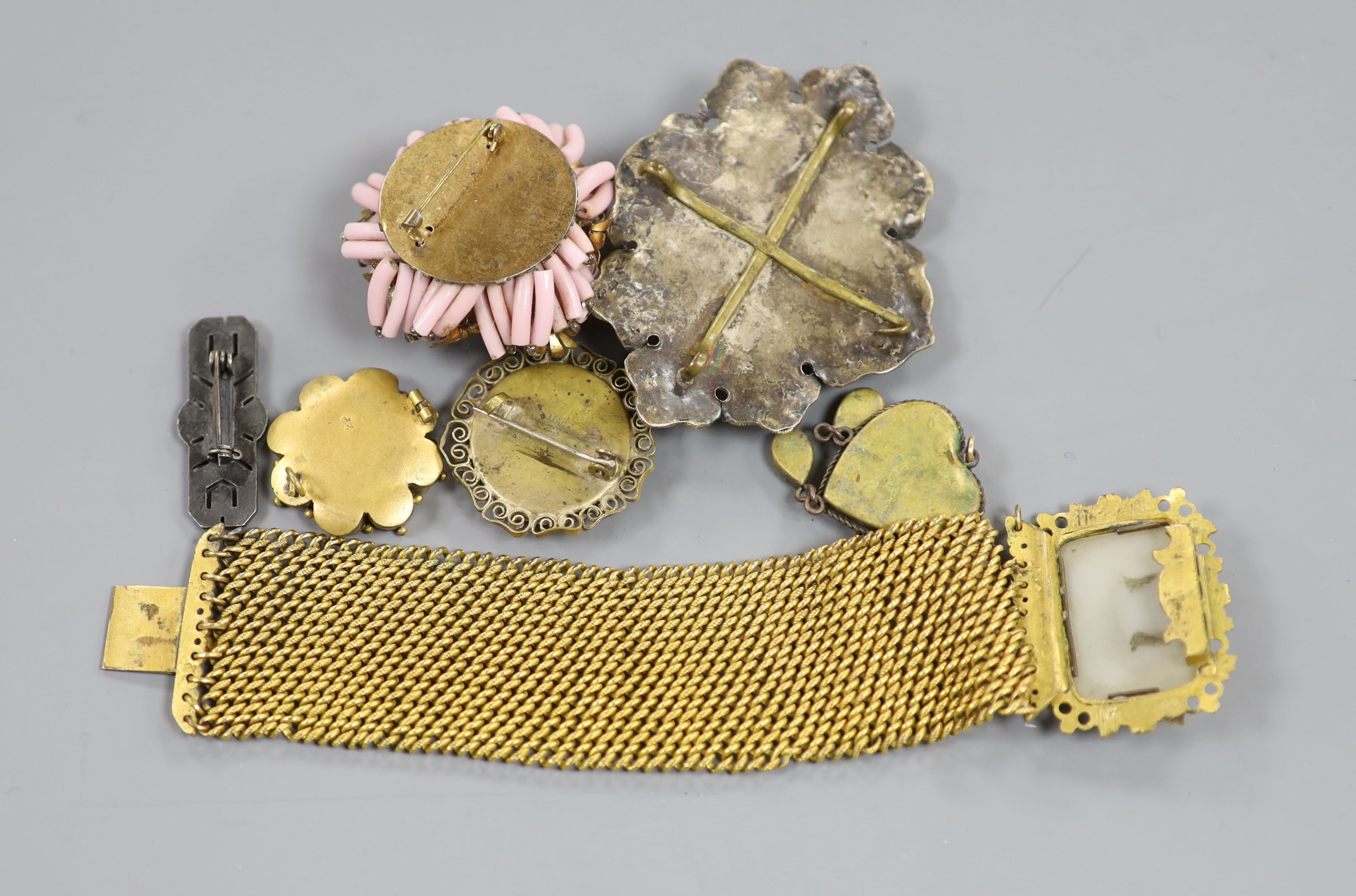 Seven items of Victorian and later jewellery, including a pinchbeck bracelet with hardstone cameo clasp, 18.2cm, a semi precious gem set Indian turban mount?, three micro mosaic items, etc.